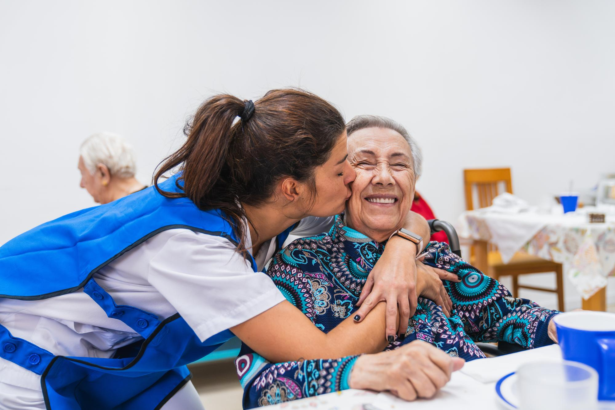 Caring nurse with elderly woman